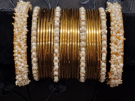 Gold metal bangles set with ivory and golden kangan bangles with pearls For Cheap