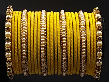 Traditional yellow velvet bangles with broad side pearl kangan For Cheap