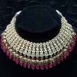 Bridal kundan piece is four layered set with dangling emeralds to match your festive. Hot on Sale