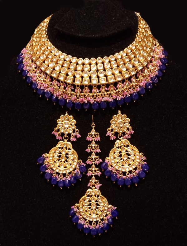 Bridal kundan piece is four layered set with dangling emeralds to match your festive. Hot on Sale