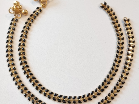 Gold plated with black enamel anklet. on Sale